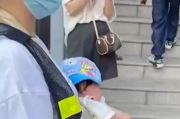 百色教育局通报家长抱婴儿站护学岗：已责成学校整改！